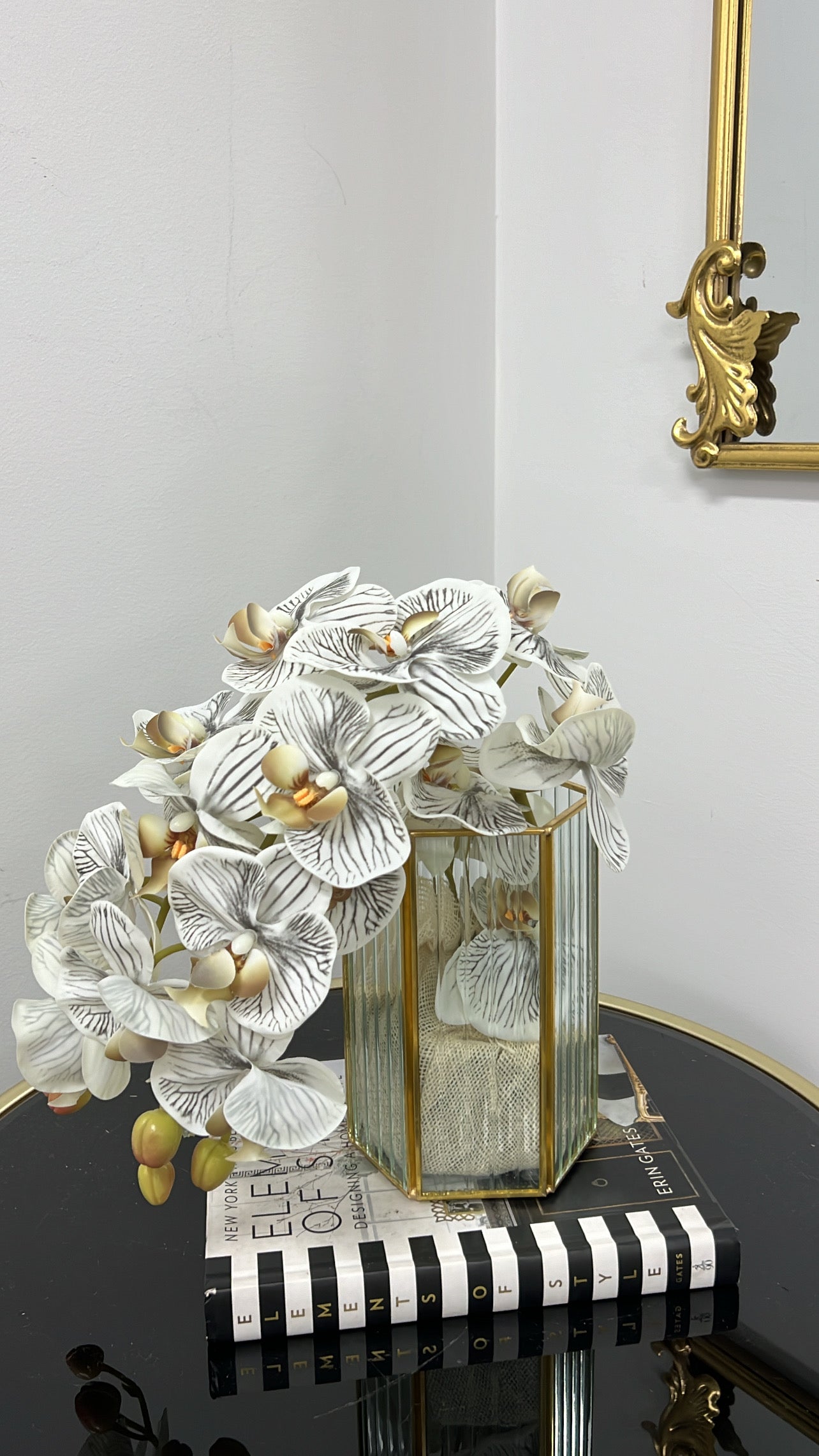 Gold ribbed glass vase and orchids