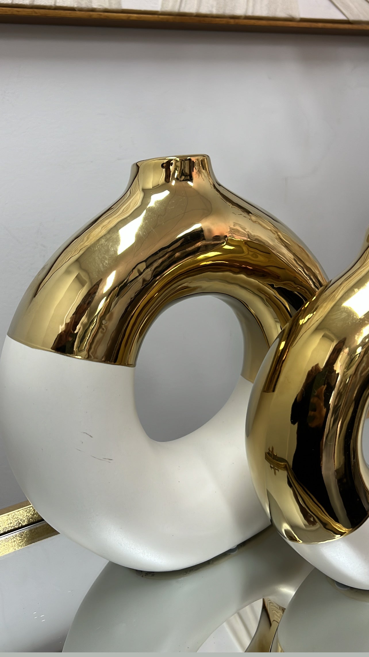 White and gold round vase