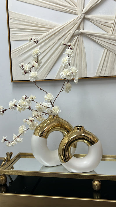 White and gold round vase