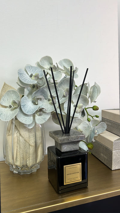 glass ribbed vase with real touch orchids