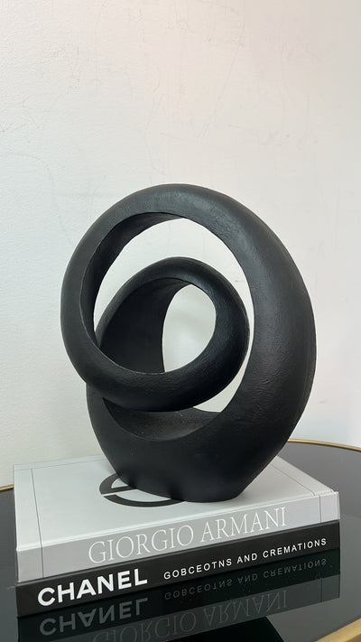 Black loop abstract sculpture